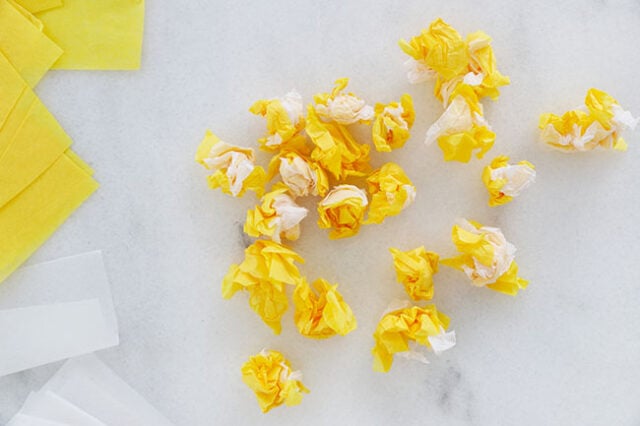 Crumple the tissue paper into balls