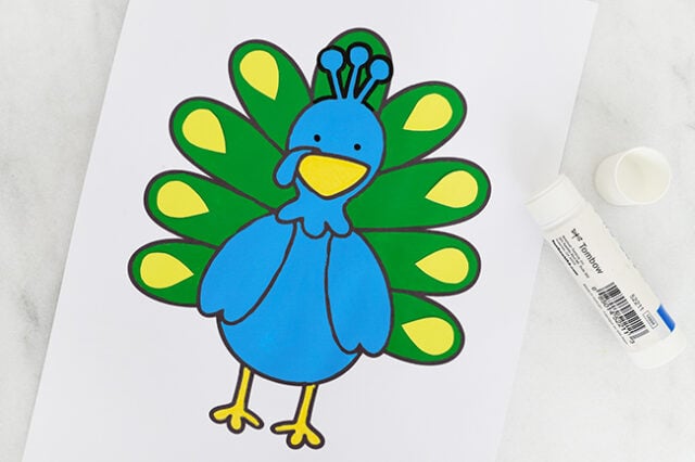 Glue down yellow feather details