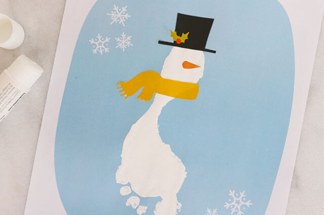 Gluing down snowman details