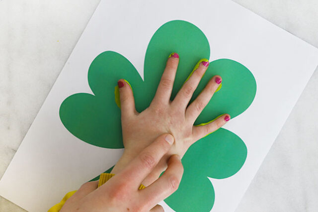 Hand stamping shamrock paper