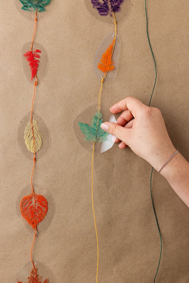 Loop string through holes