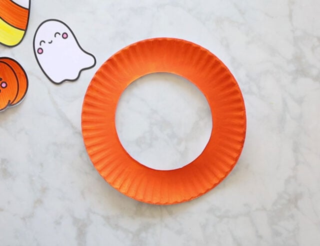 Paint the paper plate orange