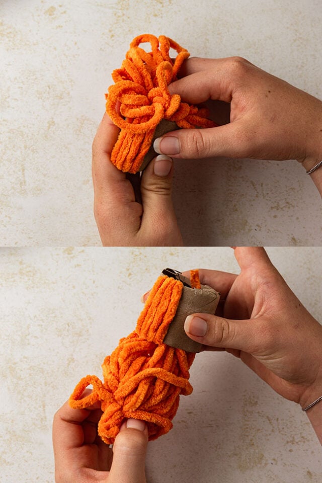 Pull yarn through paper roll